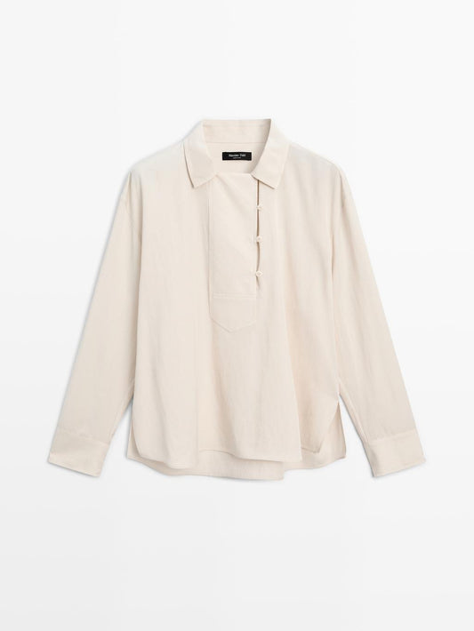 Flowing blouse with button detail