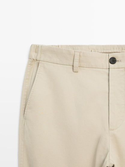 Slim fit trousers with elastic side detail