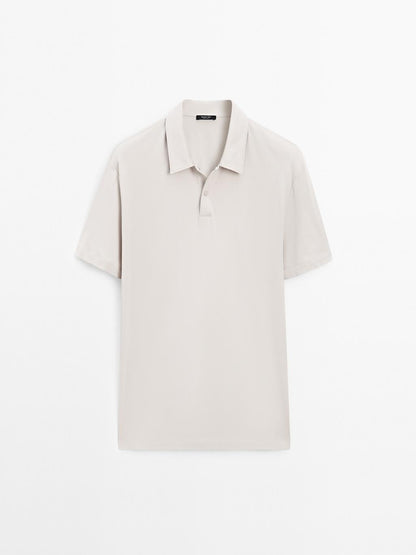 Short sleeve polo shirt with snap-button placket