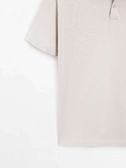 Short sleeve polo shirt with snap-button placket