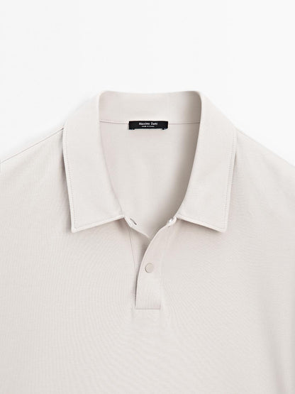Short sleeve polo shirt with snap-button placket