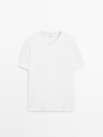 Short sleeve pyjama top and striped trousers