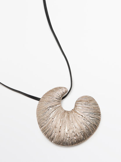 Necklace with fossil piece pendant