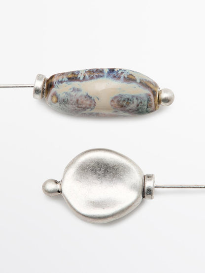 Brooch with ceramic leaf piece