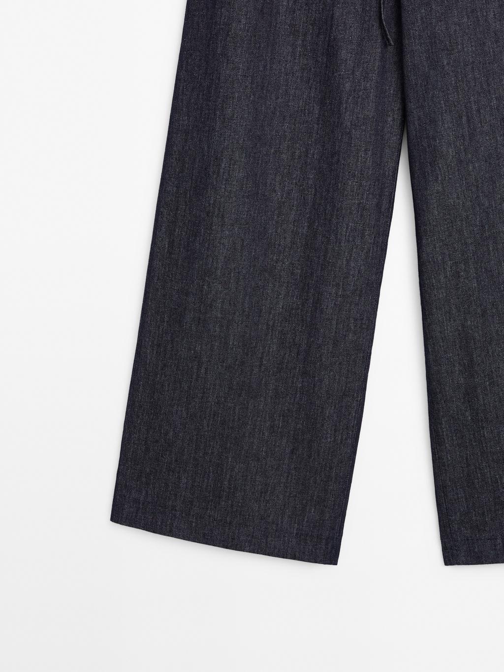 High-waist wide-leg jeans with belt