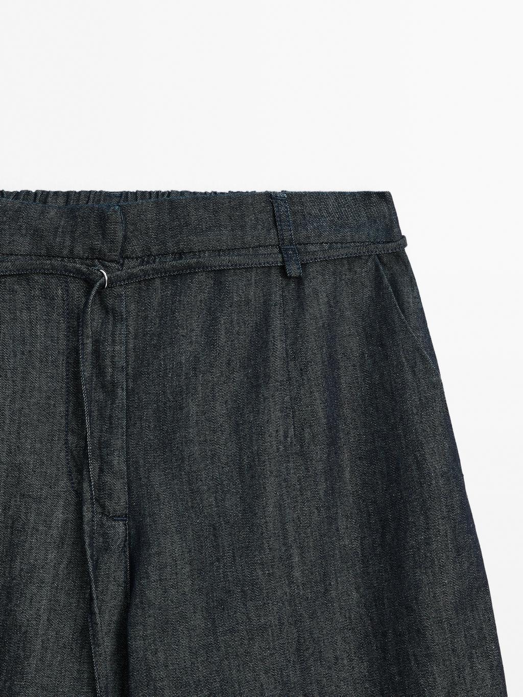 High-waist wide-leg jeans with belt