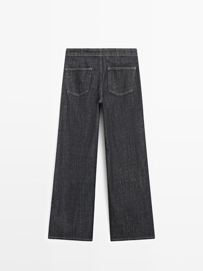 High-waist wide-leg jeans with chains