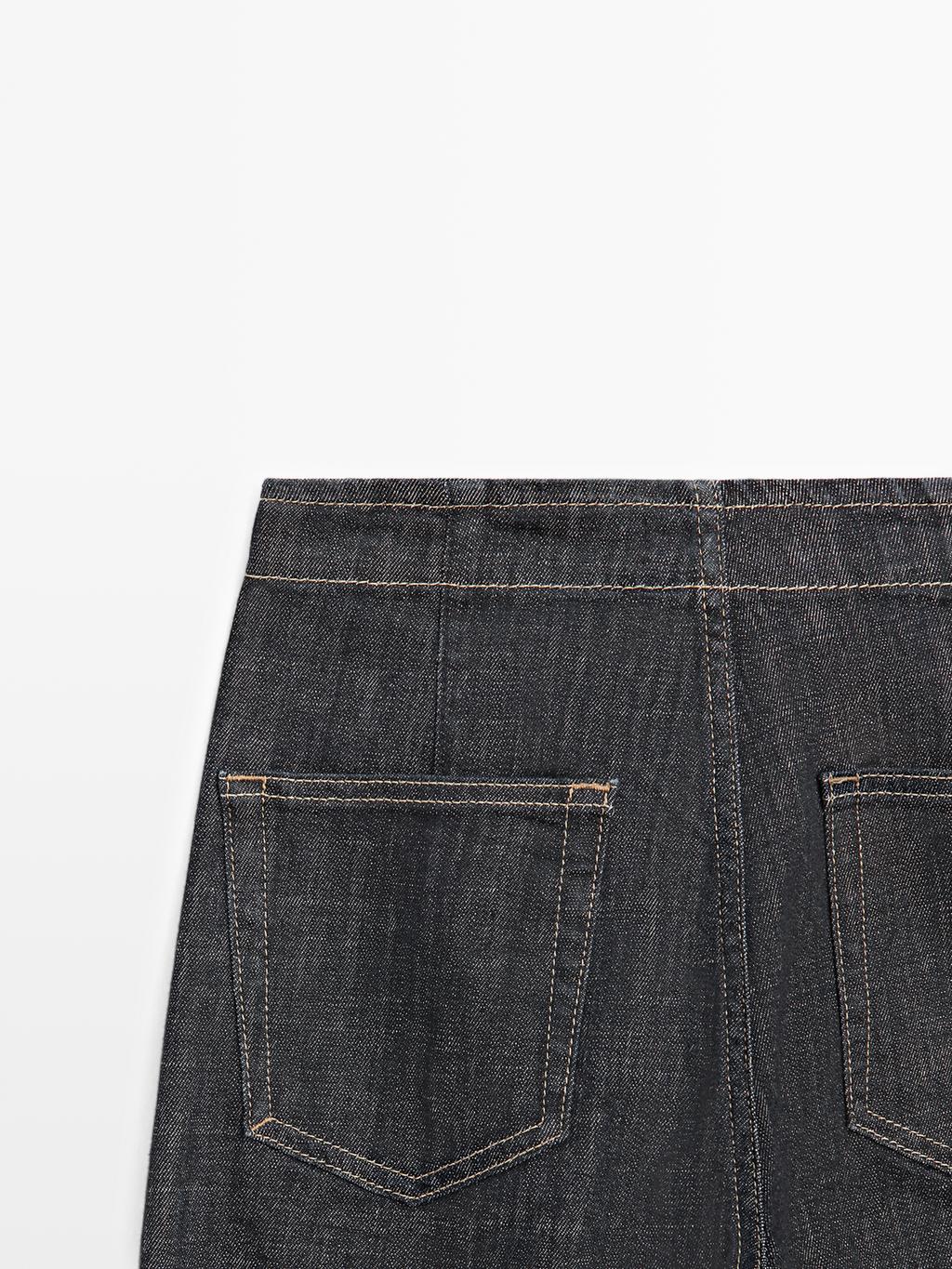 High-waist wide-leg jeans with chains