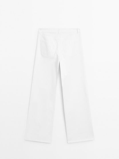 Textured wide-leg denim-effect trousers