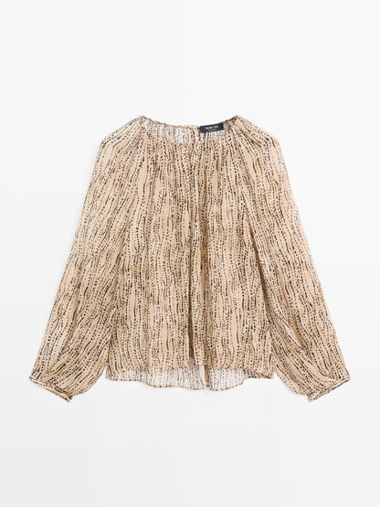 Semi-sheer draped blouse