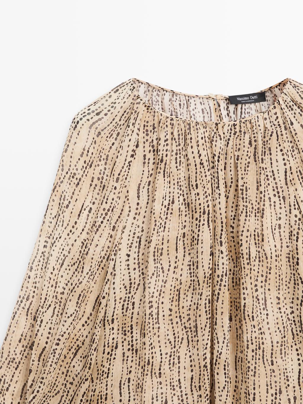 Semi-sheer draped blouse