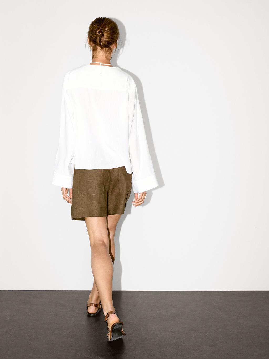 Flowing linen blend blouse with V-neckline