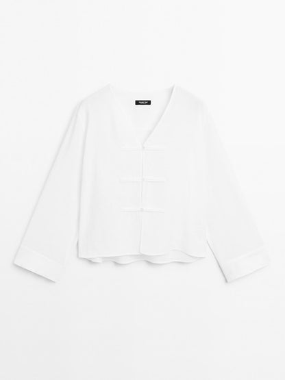 Flowing linen blend blouse with V-neckline