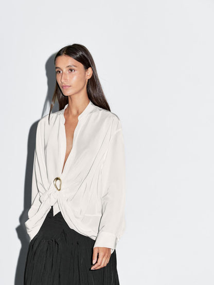 Blouse with knotted neckline and brooch detail