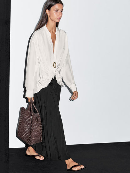 Blouse with knotted neckline and brooch detail