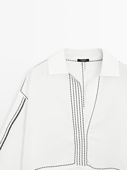 Loose-fitting blouse with contrast details