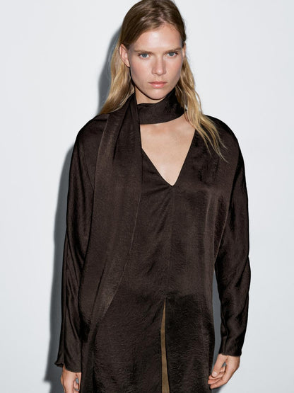 Long flowing blouse with tied neck