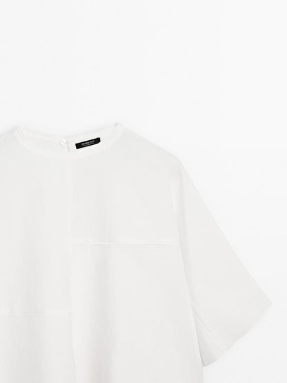 Short cape with seam details