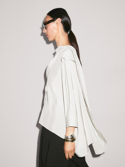 Short flowing cape with sleeve detail