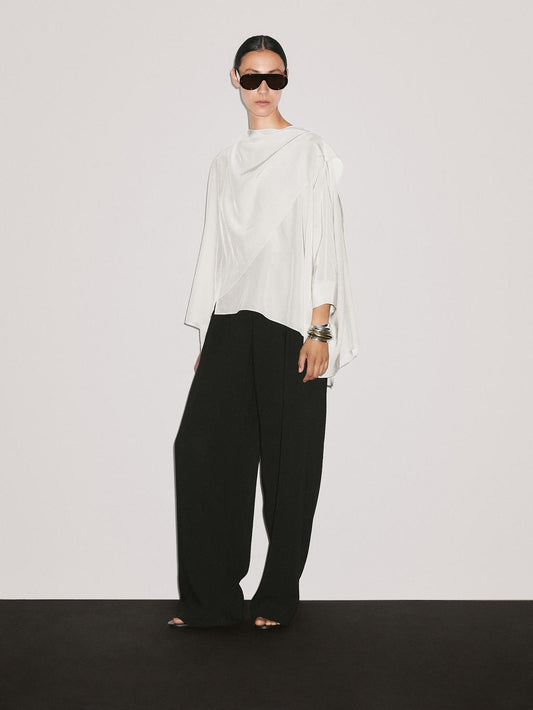 Short flowing cape with sleeve detail