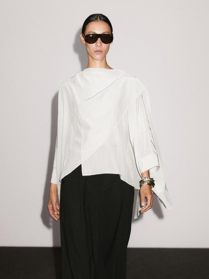 Short flowing cape with sleeve detail