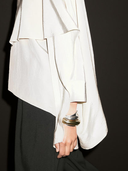 Short flowing cape with sleeve detail