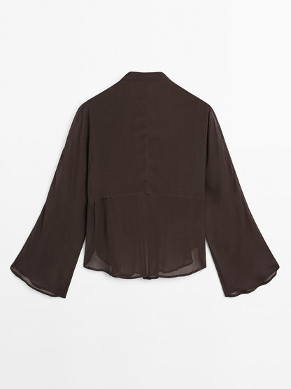 Flowing bib-front shirt with ruffles