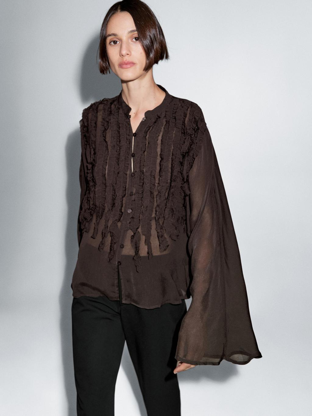 Flowing bib-front shirt with ruffles