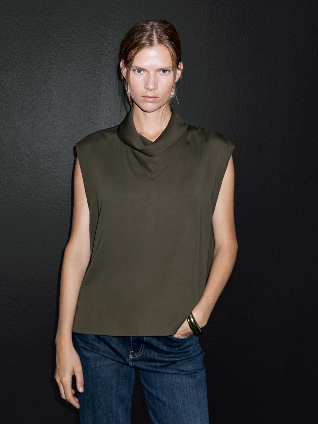 Flowing blouse with draped neck detail