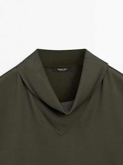 Flowing blouse with draped neck detail