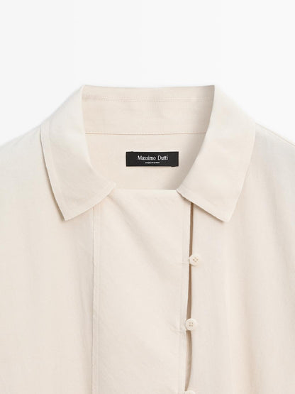 Flowing blouse with button detail