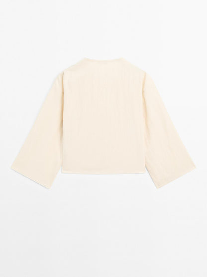 Long sleeve blouse with side button fastening