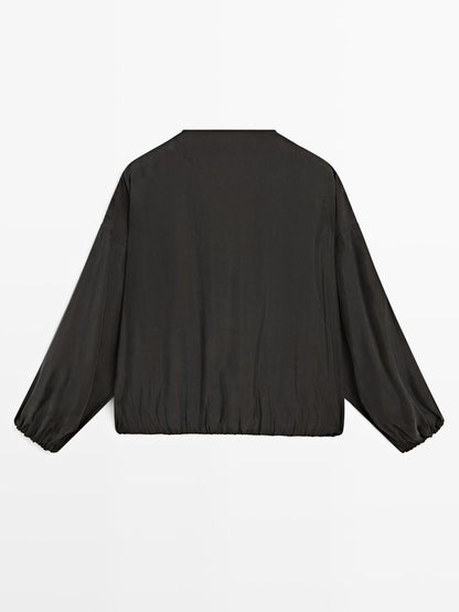 Flowing blouse with drawstring details