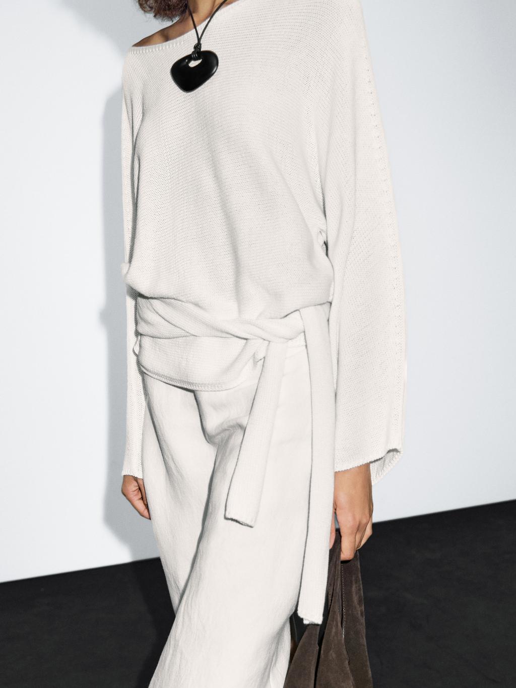 Knit sweater with bow detail