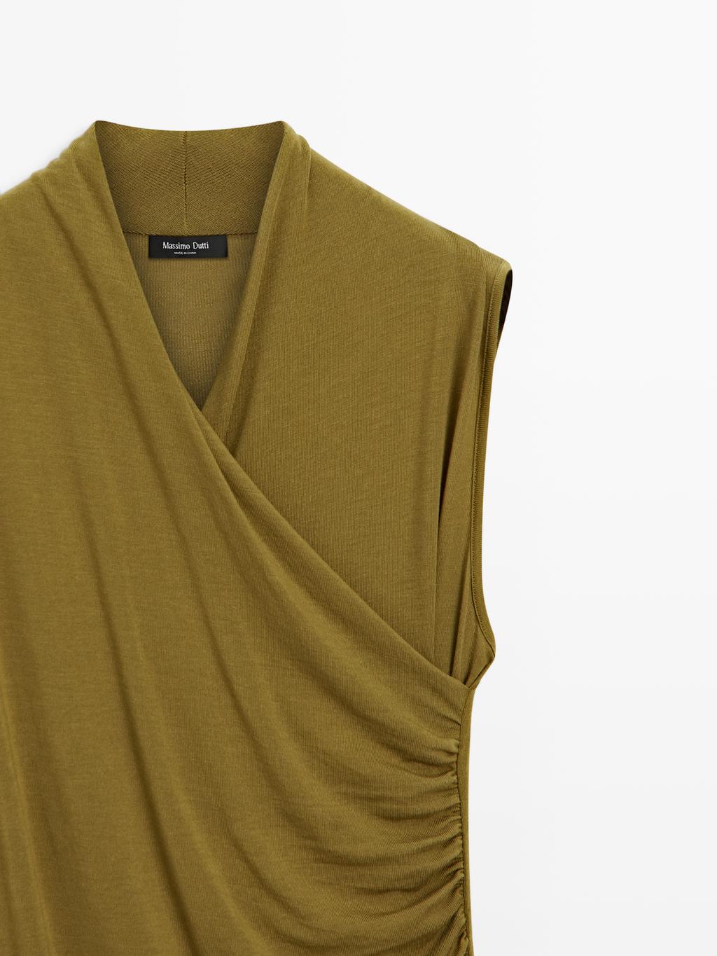 Draped top with surplice neckline