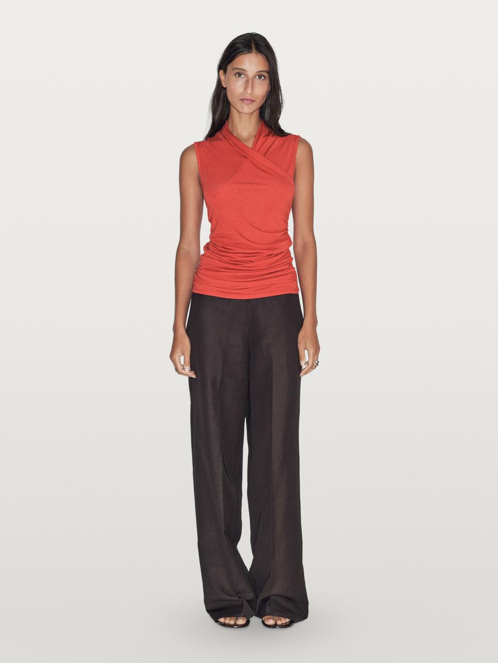 Draped top with surplice neckline