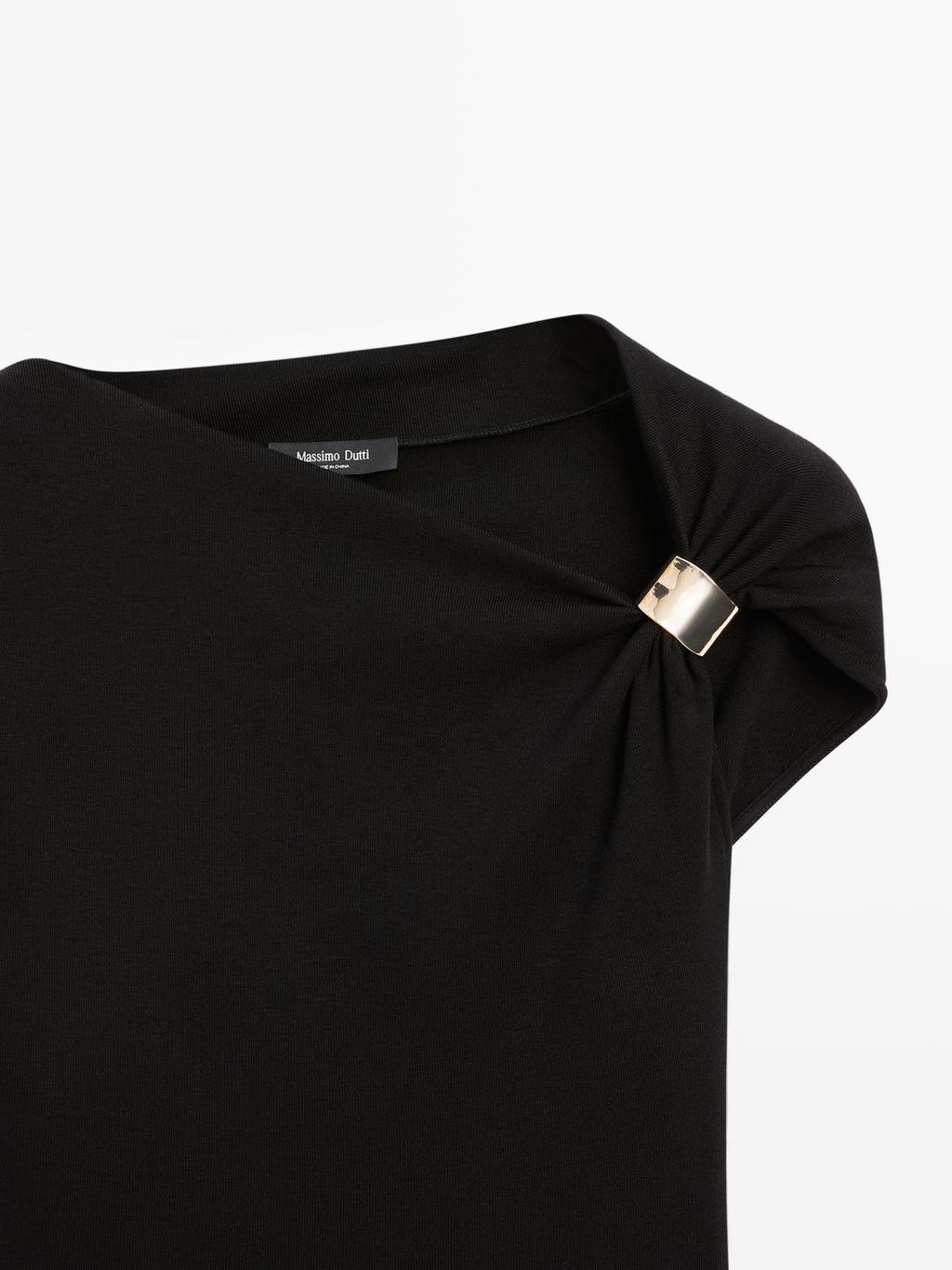 Sleeveless draped top with shoulder applique