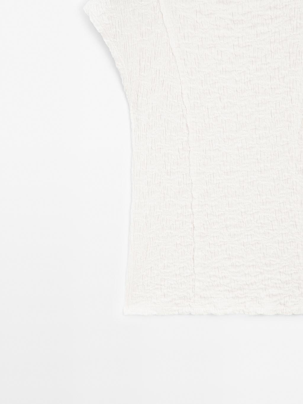 Sleeveless top with gathered detail