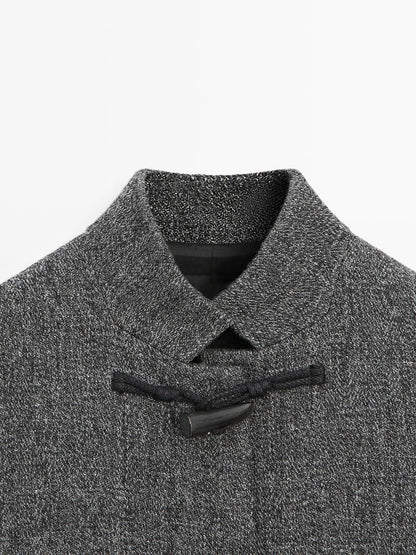 Mid-length coat with horn toggle