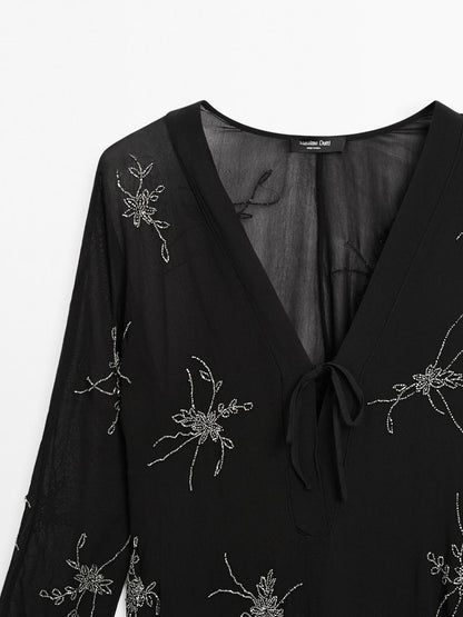 Flowing midi dress with embroidery