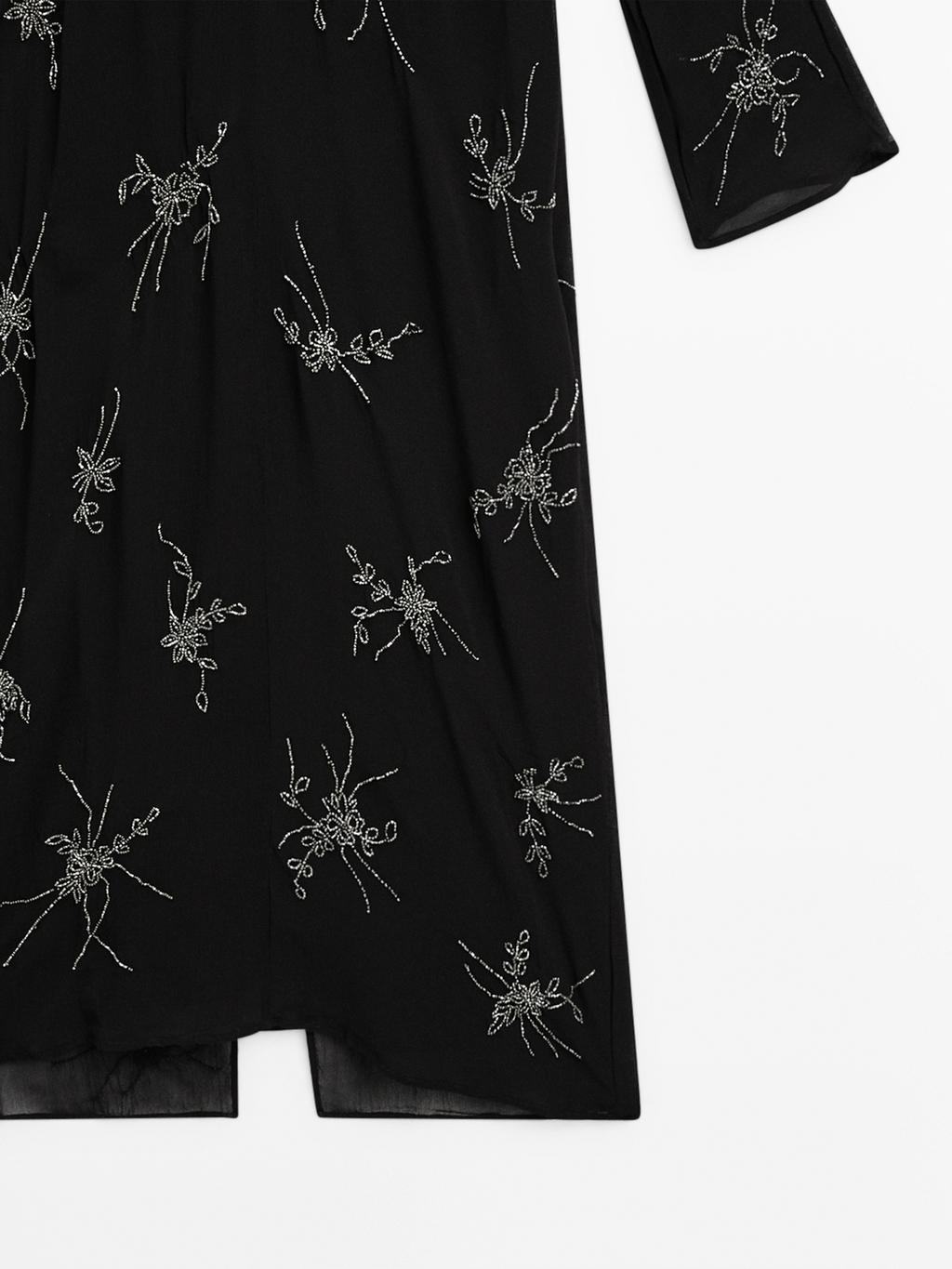 Flowing midi dress with embroidery