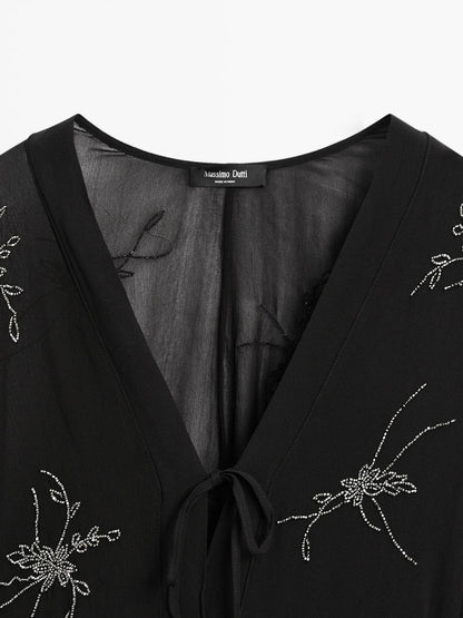 Flowing midi dress with embroidery