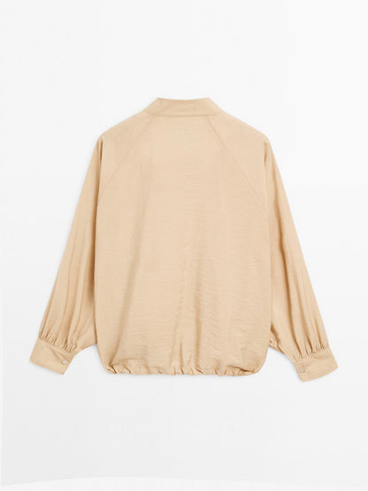 Loose-fitting bomber jacket with drawstring detail