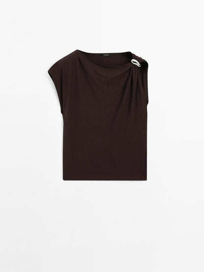 Draped neckline top with brooch detail
