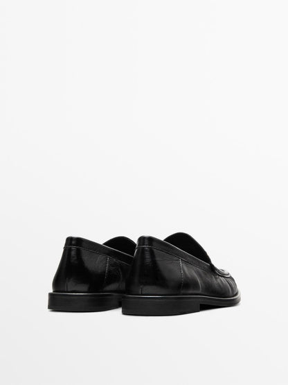 Crackled leather loafers with decorative detail