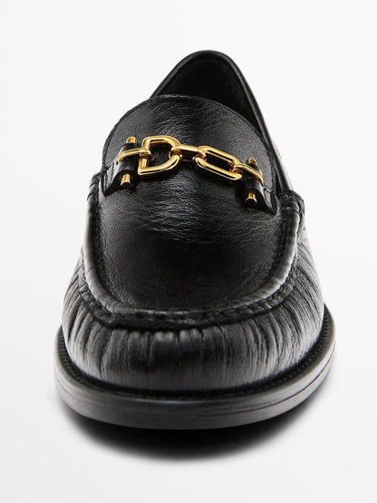 Crackled leather loafers with decorative detail